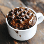 Vegan Protein Mug Cake – Fast, Delicious and Plant-Based 6 vegan protein mug cake in a ceramic mug with melted chocolate