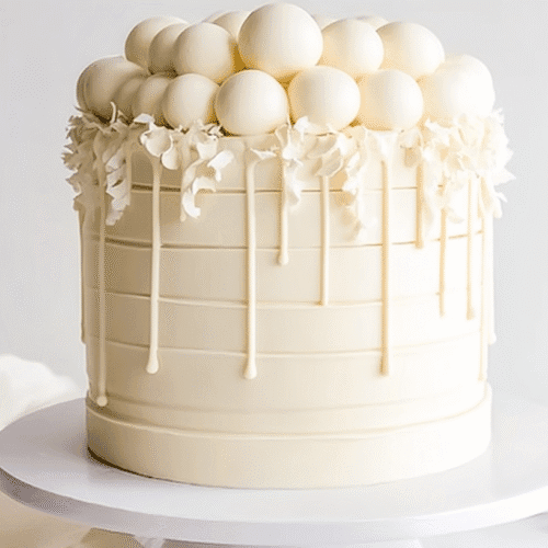 Decadent White Chocolate Cake with Swiss Meringue Buttercream & Ganache 2 mohamedb 47441 simple white chocolate cake taken with an old ca a934d738 6110 43e9 940c bc2b58c1de30 - Decadent White Chocolate Cake with Swiss Meringue Buttercream & Ganache